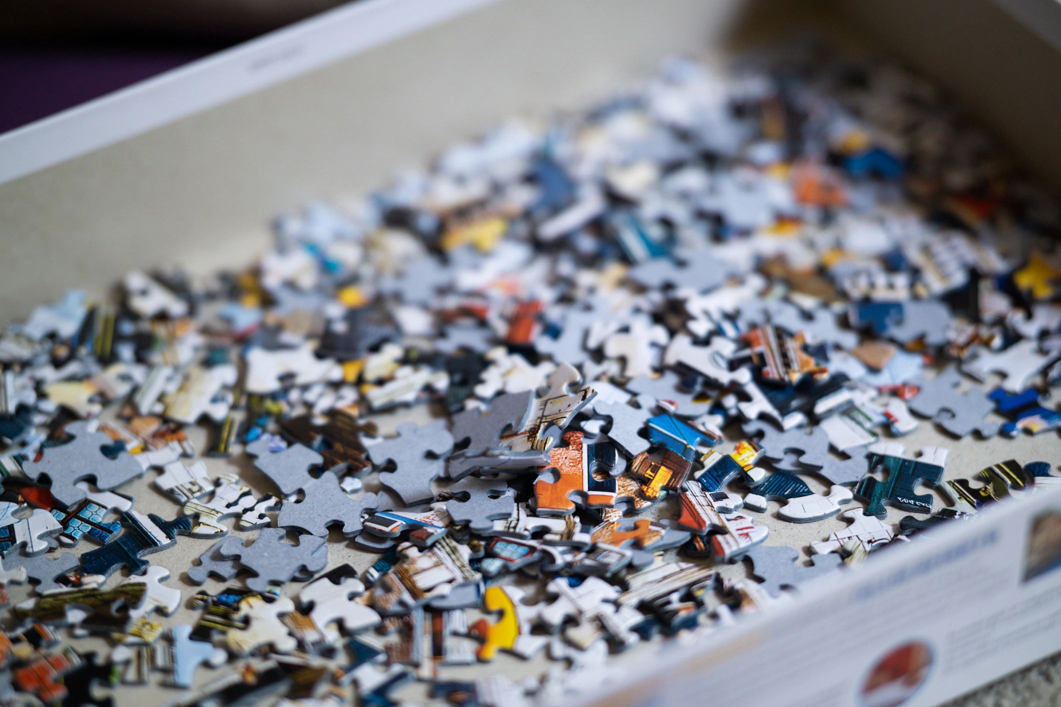 Close-up of puzzle pieces representing escape room puzzles