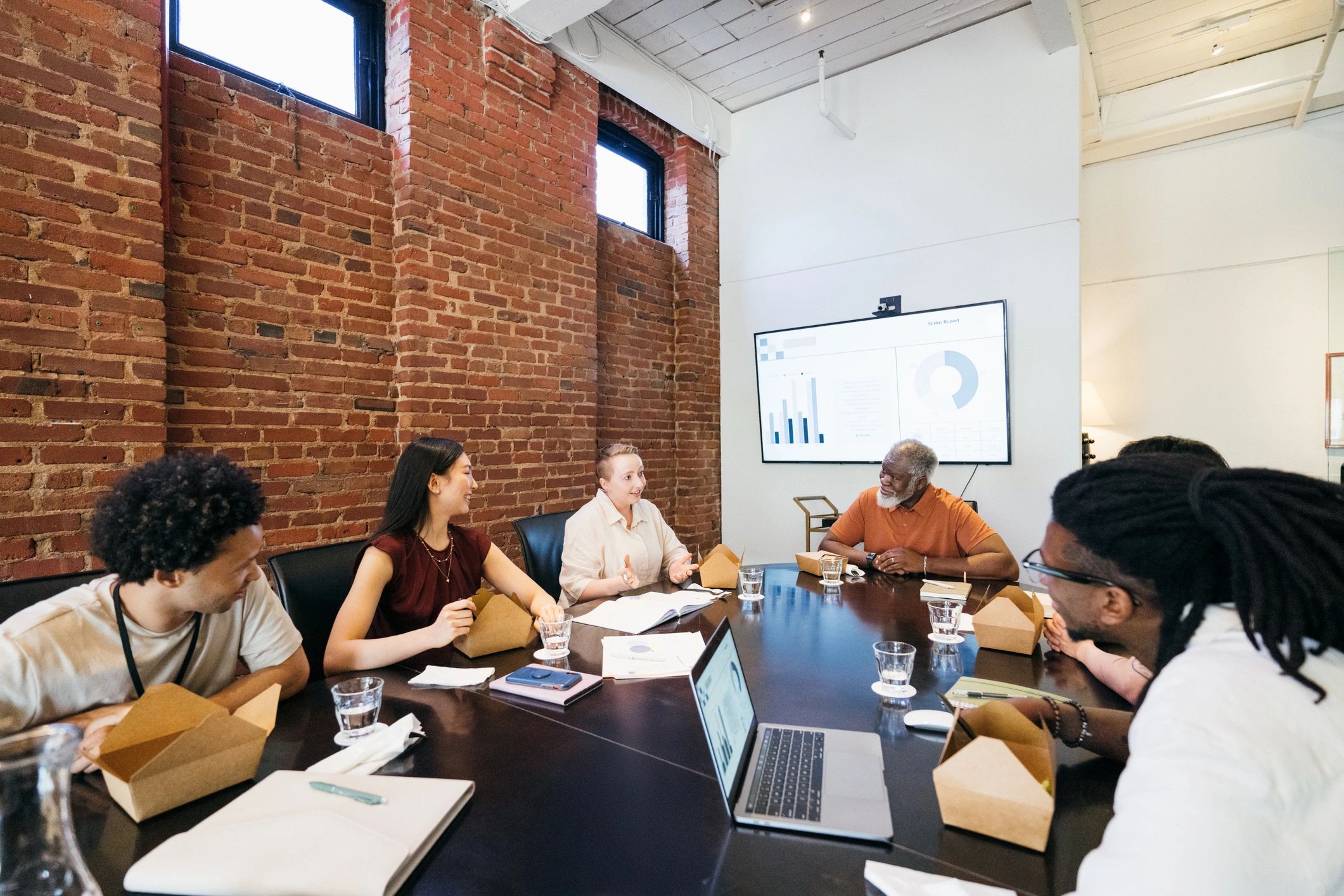 Team meeting together in a conference room