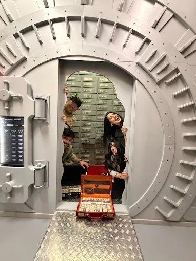 Group celebrating inside Casino Heist escape room at PanIQ Room West Hollywood